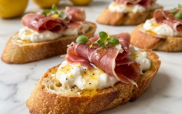 Beef Prosciutto Crostini with Burrata and Lemon Honey Drizzle